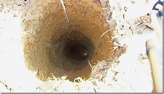 Hundreds of people are flocking to a field in Pattingham in Austria after a mysterious perfectly round hole appeared overnight, leading down to a metallic construction 25-foot underground. Farmer Franz Knoglinger, 47, discovered the hole while looking for his missing cat and after a report on local television he was flooded with curious visitors, as well as geologists, archaeologists and even UFO experts.