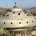 Old rusty UFO sculpture in a desert ghost town