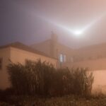 big bright light in sky above building