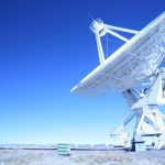 white satellite dish under the blue sky